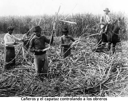 Caeros y el capataz controlando a los obreros